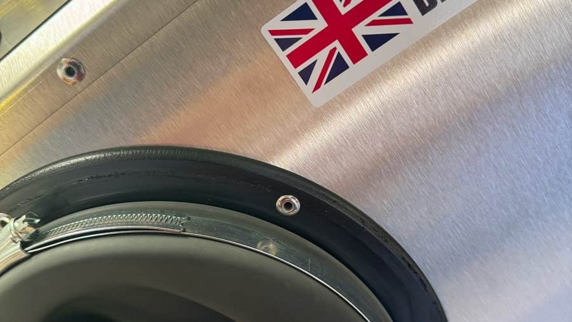 Close up of vapour blasted metal surface showing smooth, clean finish